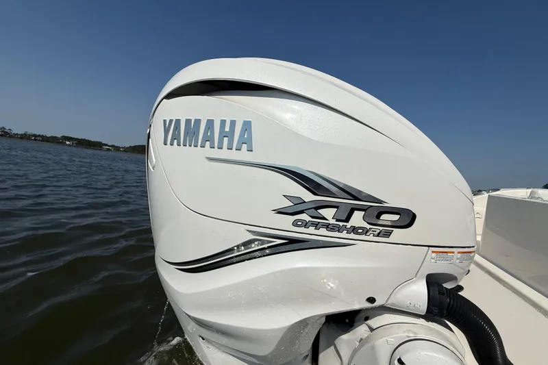 Slide: The Image of Yamaha XTO Offshore engine on 2023 Cobia 350 Center Console boat in water. - 9