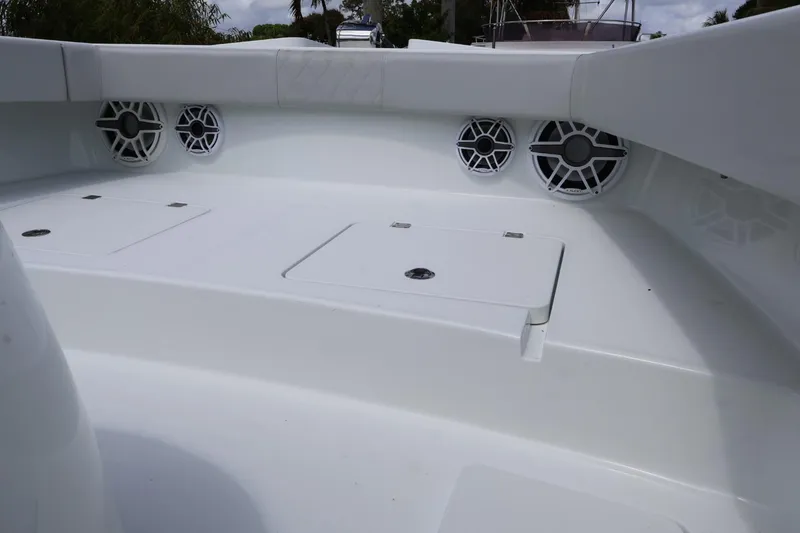 Slide: The Image of Interior of 2021 Freeman 42LR boat featuring storage compartments and speakers. - 10