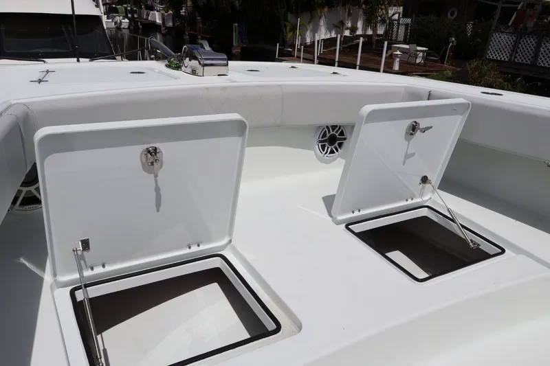 Slide: The Image of Open storage compartments on a 2021 Freeman 42LR boat deck. - 16