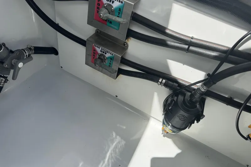 Slide: The Image of Boat fuel system components in a 2021 Freeman 42LR, featuring valves and hoses. - 20