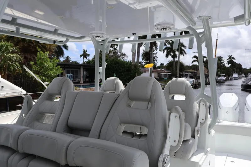 Slide: The Image of Luxury seating on a 2021 Freeman 42LR boat, featuring sleek design and waterfront view. - 4