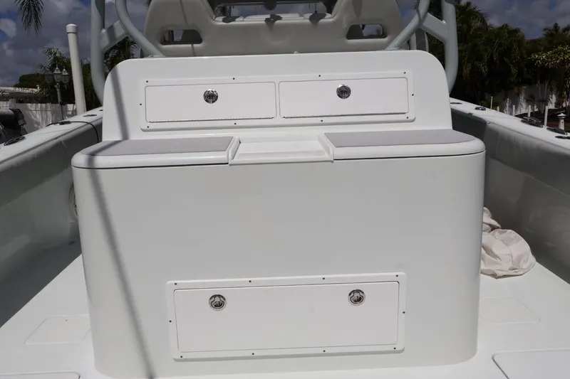Slide: The Image of Freeman 42LR 2021 boat console with storage compartments and seating. - 7
