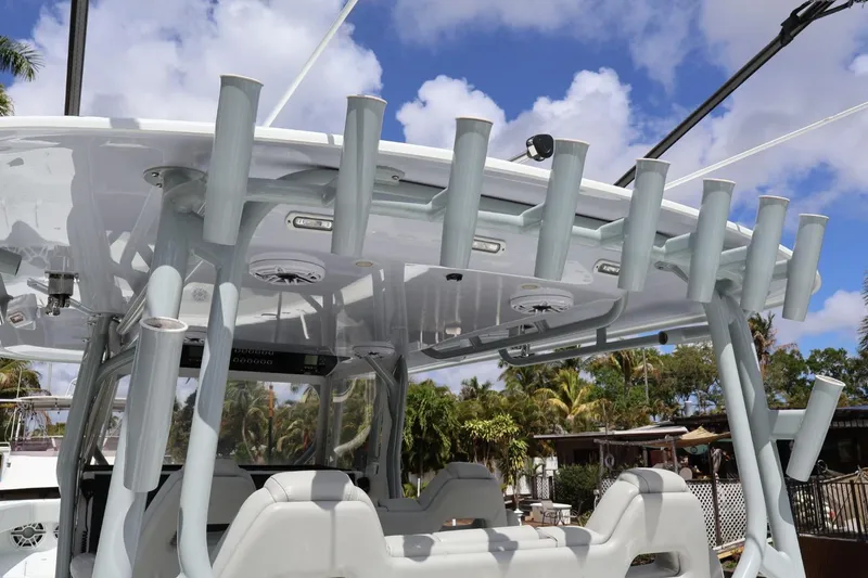 Slide: The Image of 2021 Freeman 42LR boat with rod holders and seating under a clear blue sky. - 9