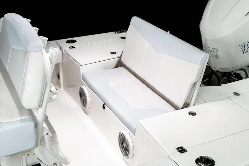 Slide: The Image of Manufacturer Provided Image: 2022 Robalo 246 Cayman boat interior with cushioned seating and storage compartments. - 10