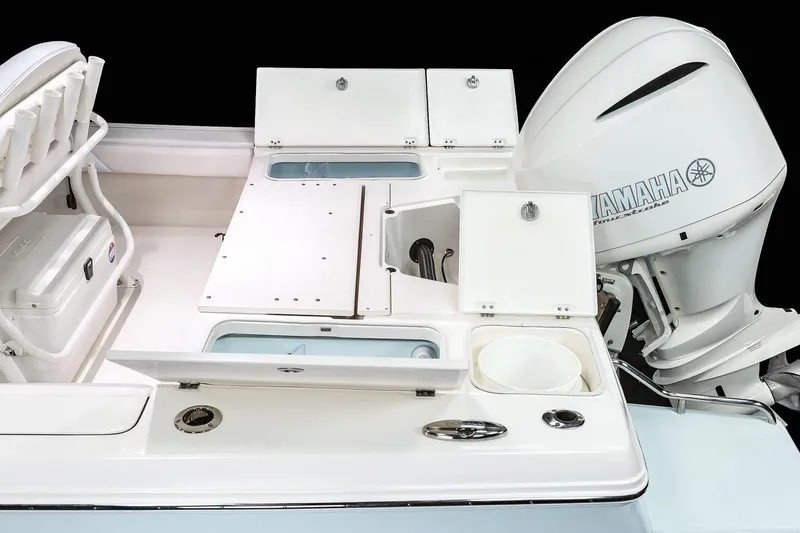 Slide: The Image of Manufacturer Provided Image: 2022 Robalo 246 Cayman boat with Yamaha engine and storage compartments. - 12