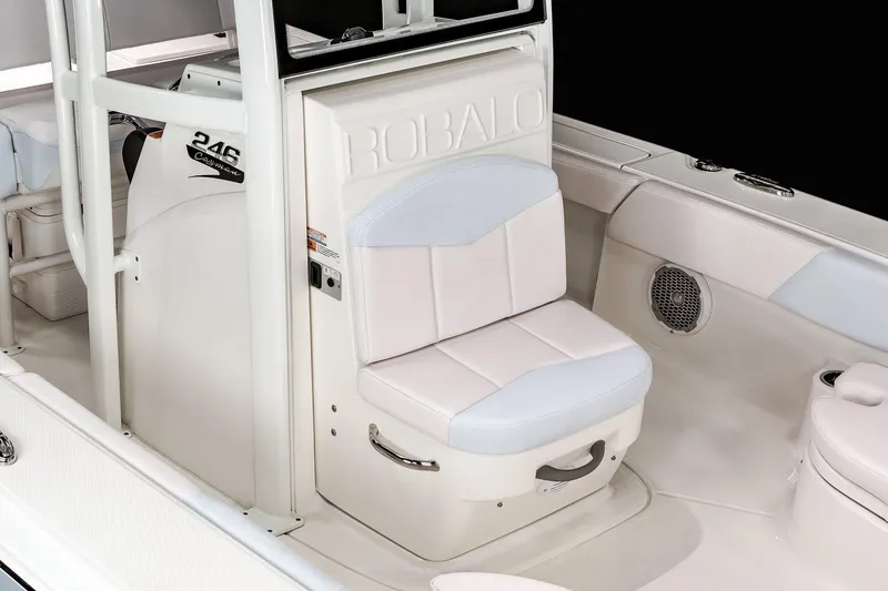 Slide: The Image of Manufacturer Provided Image: 2022 Robalo 246 Cayman boat interior with cushioned seating and storage. - 5