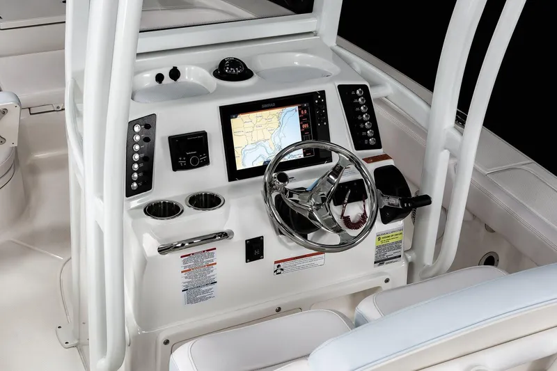 Slide: The Image of Manufacturer Provided Image: 2022 Robalo 246 Cayman boat dashboard with navigation system and steering wheel. - 6