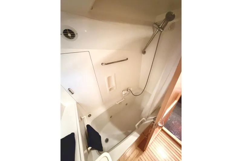 Slide: The Image of Compact bathroom with shower in 1998 Waterline Pilothouse yacht. - 14