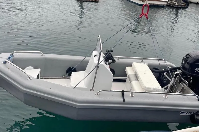 Slide: The Image of Small Waterline Pilothouse boat from 1998, docked on calm water. - 25
