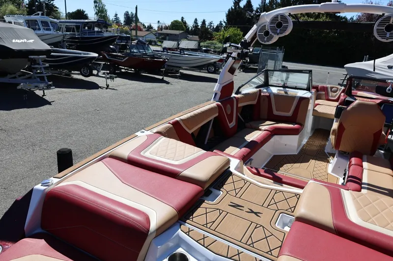 Slide: The Image of 2022 Tigé 25ZX boat interior with luxurious seating and modern design. - 19