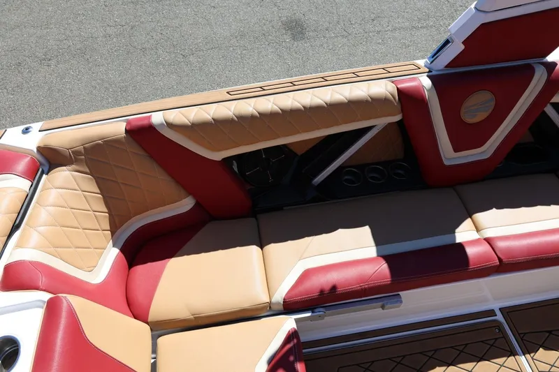 Slide: The Image of Luxurious interior of 2022 Tigé 25ZX boat with red and tan upholstery. - 31