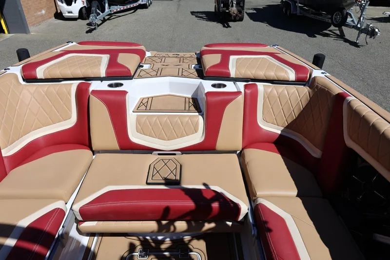 Slide: The Image of 2022 Tigé 25ZX boat interior with red and tan diamond-stitched upholstery. - 33
