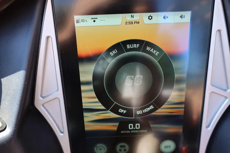 Slide: The Image of Touchscreen display of a 2022 Tigé 25ZX boat showing ski, surf, and wake options. - 59