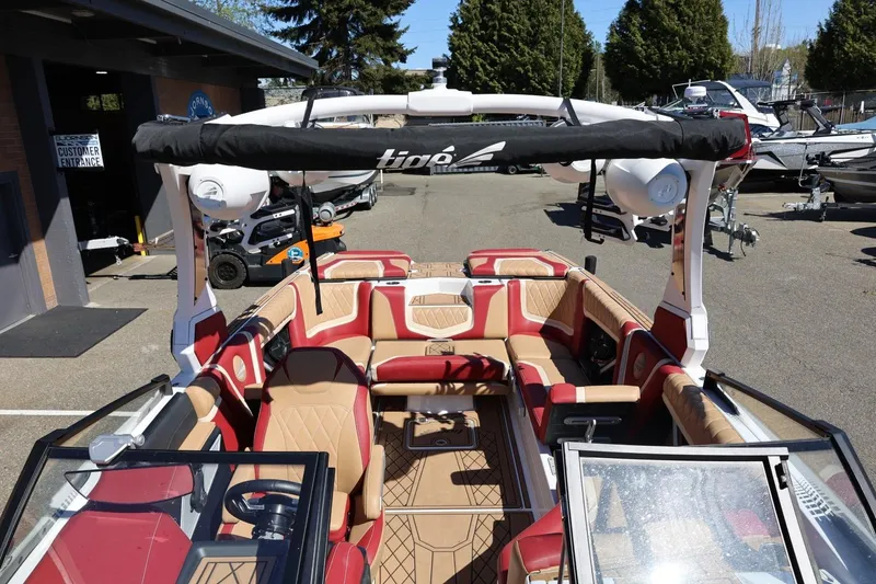 Slide: The Image of 2022 Tigé 25ZX boat interior with luxurious seating and modern design. - 67