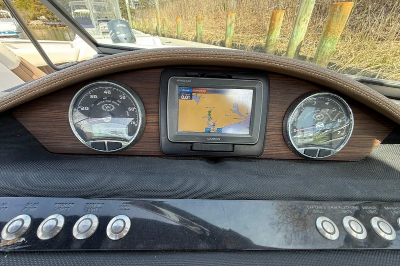 Slide: The Image of Dashboard of a 2015 Cobalt 26SD boat with Garmin GPS and gauges. - 12