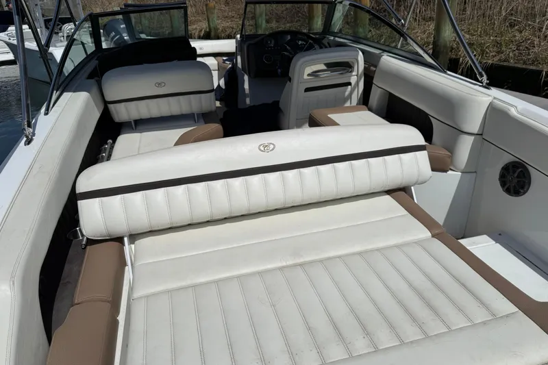 Slide: The Image of Interior of a 2015 Cobalt 26SD boat with white leather seats. - 8