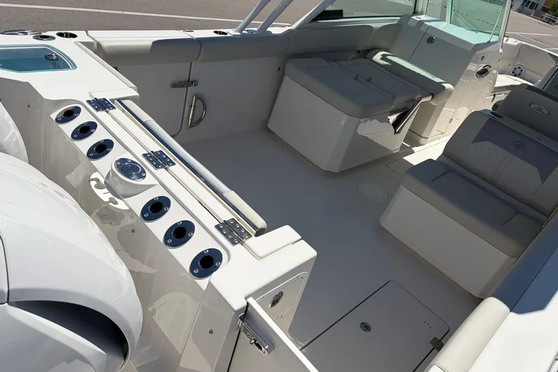 Slide: The Image of 2026 Sailfish 276 DC boat interior with seating and rod holders. - 12