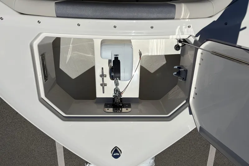 Slide: The Image of Anchor compartment of 2026 Sailfish 276 DC boat, showcasing storage and mechanism. - 15