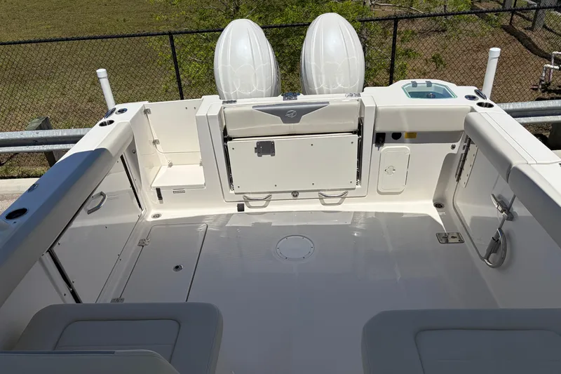 Slide: The Image of 2026 Sailfish 276 DC boat deck with seating and storage compartments. - 16