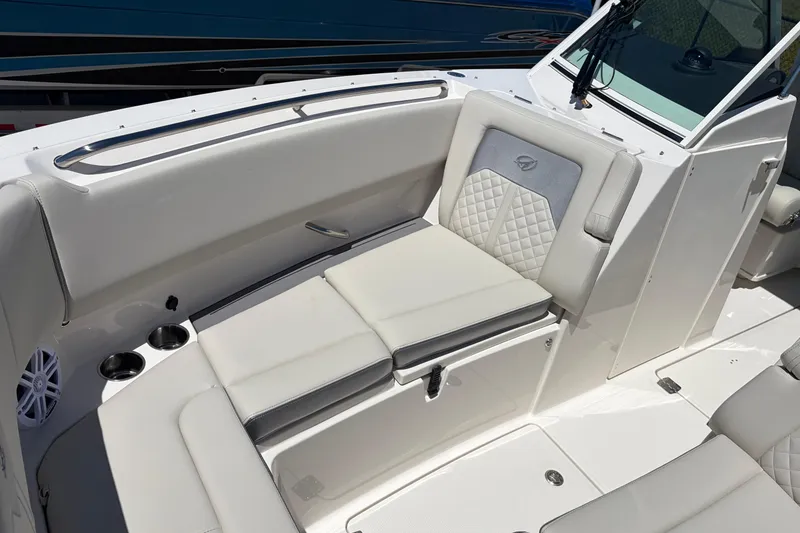 Slide: The Image of Luxurious seating on 2026 Sailfish 276 DC boat with cup holders and quilted upholstery. - 20