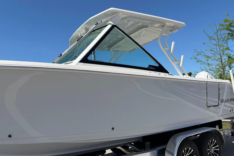 Slide: The Image of 2026 Sailfish 276 DC boat side view with sleek design and modern features. - 3
