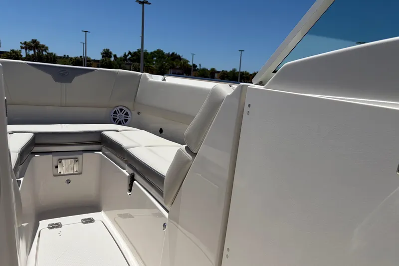 Slide: The Image of Interior view of 2026 Sailfish 276 DC boat with cushioned seating and speaker. - 32