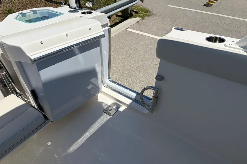 Slide: The Image of 2026 Sailfish 276 DC boat interior with seating and cup holders. - 35