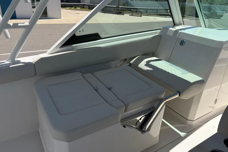 Slide: The Image of 2026 Sailfish 276 DC boat interior seating with modern design and white upholstery. - 36
