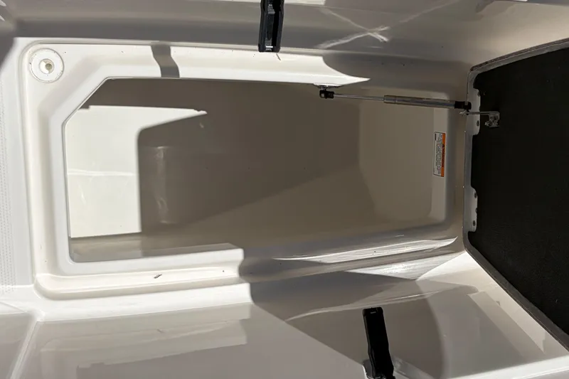 Slide: The Image of Storage compartment of 2026 Sailfish 276 DC boat, featuring a clean, white interior. - 39