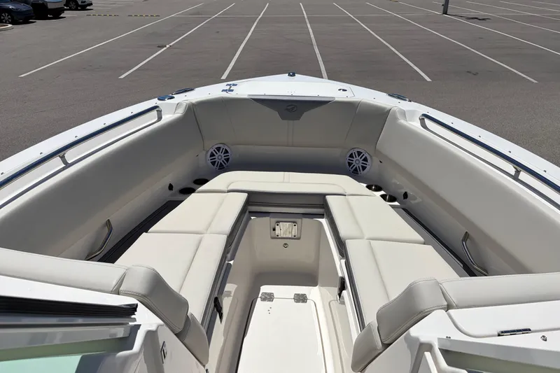 Slide: The Image of 2026 Sailfish 276 DC boat interior with spacious seating in a parking lot. - 40