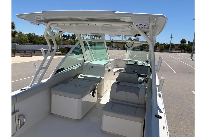 Slide: The Image of 2026 Sailfish 276 DC boat interior with seating and navigation equipment. - 42