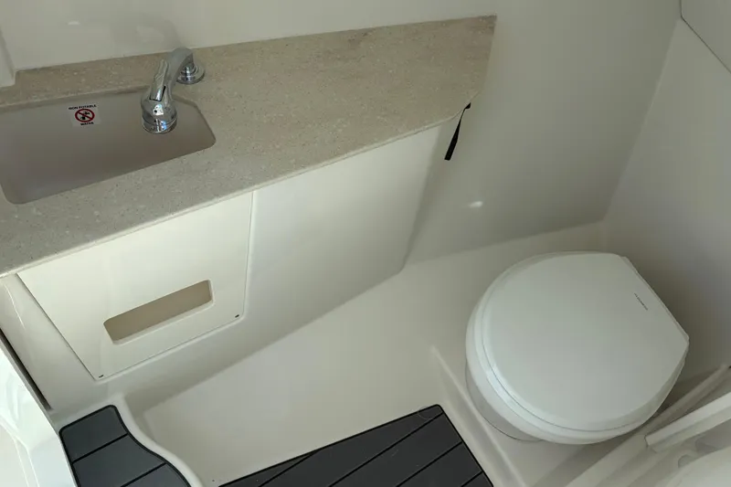 Slide: The Image of 2026 Sailfish 276 DC boat bathroom with sink and toilet. - 48