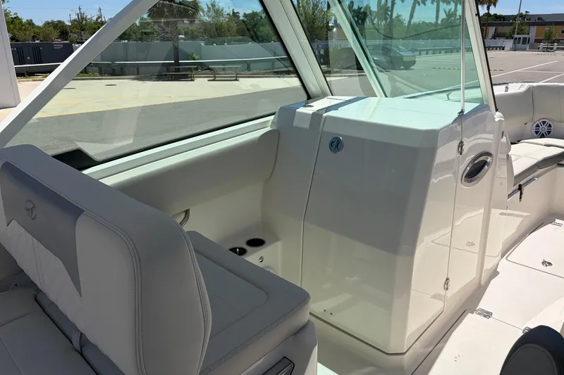 Slide: The Image of 2026 Sailfish 276 DC boat interior with seating and console, showcasing modern design. - 49
