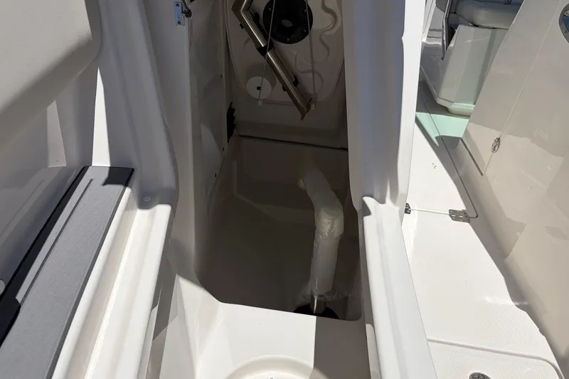 Slide: The Image of Interior view of 2026 Sailfish 276 DC boat, showcasing storage compartment details. - 50