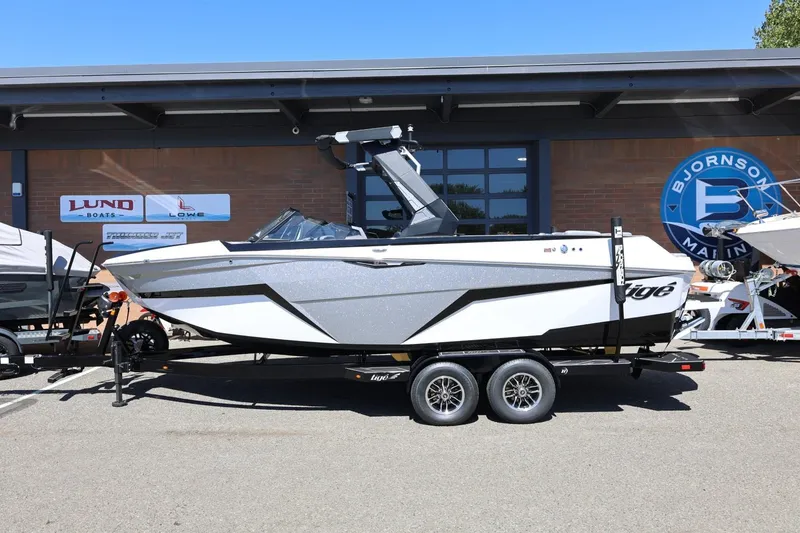 The Image of 2026 Tigé Z3 boat on trailer at Bjornson Marine dealership. - 1