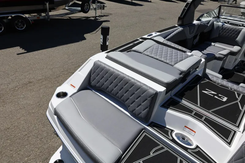 Slide: The Image of 2026 Tigé Z3 boat interior with gray quilted seating and sleek design. - 13