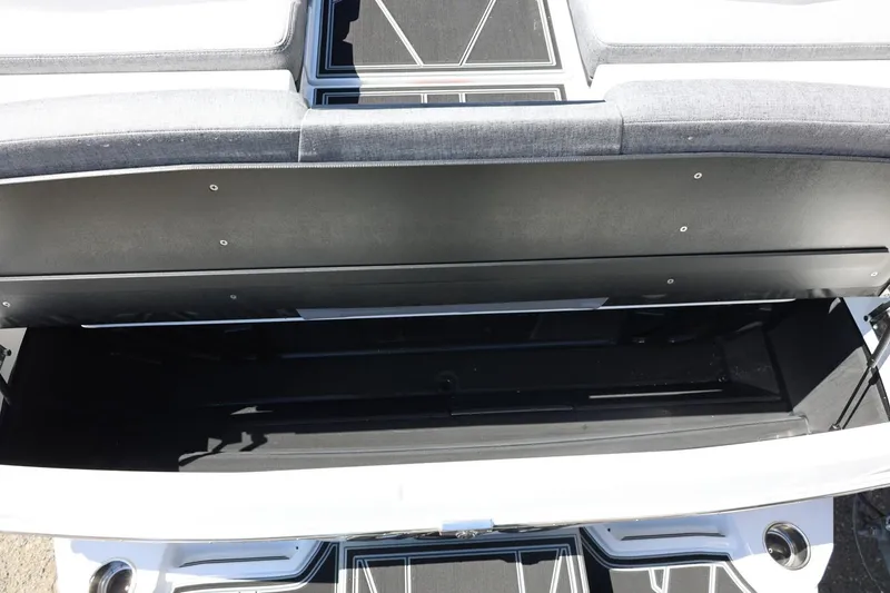 Slide: The Image of 2026 Tigé Z3 boat storage compartment with open lid, showcasing spacious interior. - 15