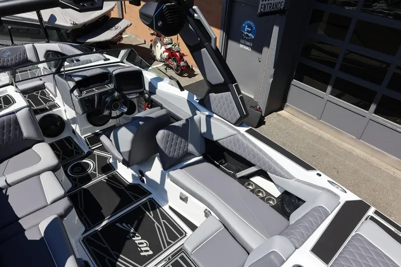 Slide: The Image of 2026 Tigé Z3 boat interior with modern design, featuring quilted seating and advanced dashboard controls. - 20