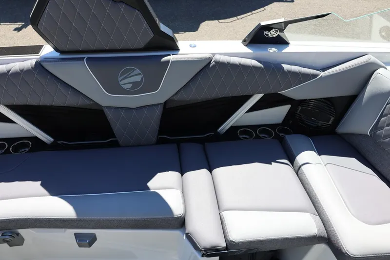 Slide: The Image of 2026 Tigé Z3 boat interior with gray quilted seating and cup holders. - 23
