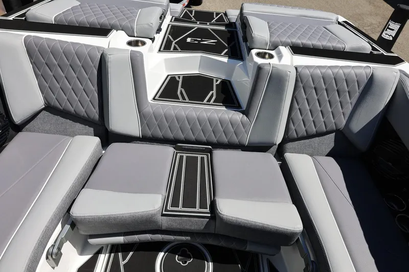 Slide: The Image of 2026 Tigé Z3 boat interior with luxurious gray seating and diamond stitching. - 26