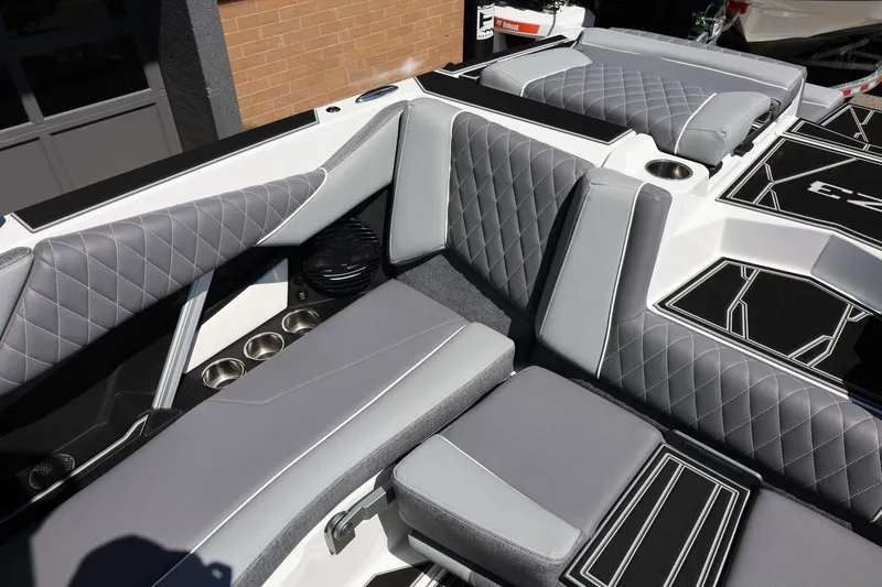 Slide: The Image of 2026 Tigé Z3 boat interior with gray quilted seating and cup holders. - 27