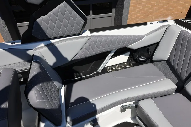 Slide: The Image of Interior seating of 2026 Tigé Z3 boat with quilted gray upholstery. - 28