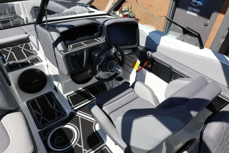 Slide: The Image of 2026 Tigé Z3 boat interior with modern dashboard and sleek seating design. - 30