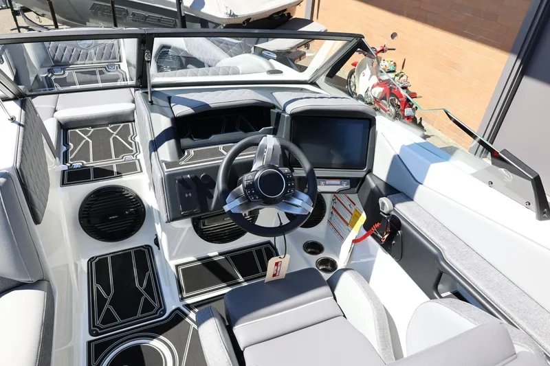 Slide: The Image of 2026 Tigé Z3 boat interior with modern dashboard and steering wheel design. - 37
