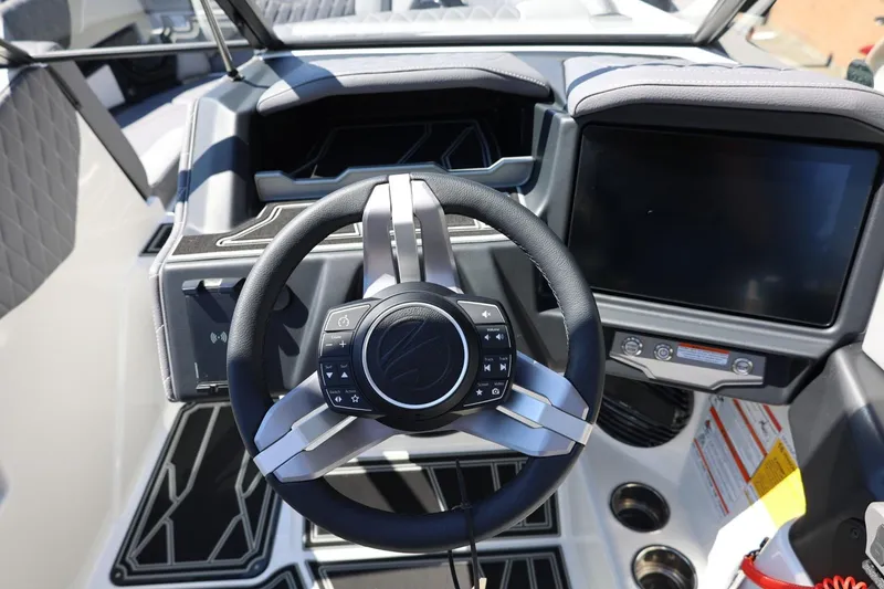 Slide: The Image of 2026 Tigé Z3 boat dashboard with steering wheel and touchscreen display. - 39