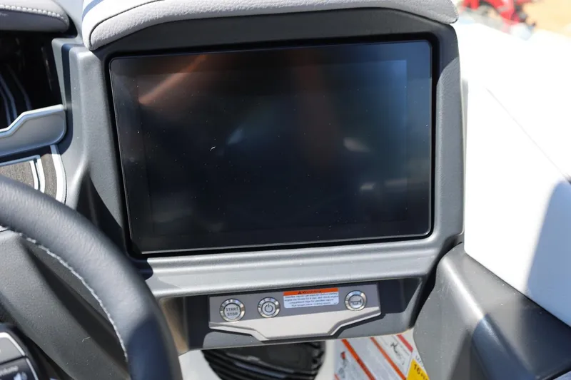 Slide: The Image of Dashboard display of 2026 Tigé Z3 boat with start/stop button. - 42
