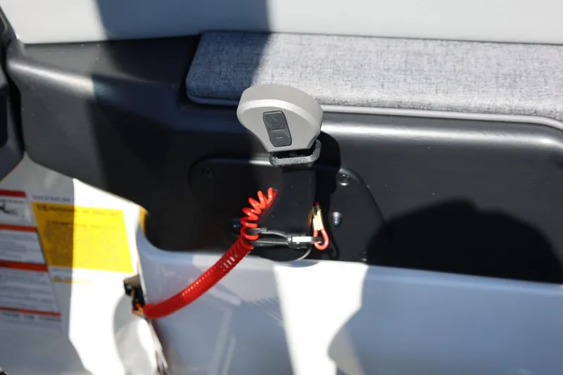 Slide: The Image of Safety switch with red cord on 2026 Tigé Z3 boat interior. - 43