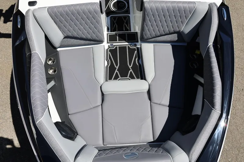 Slide: The Image of 2026 Tigé Z3 boat interior with gray quilted seating and cup holders. - 49