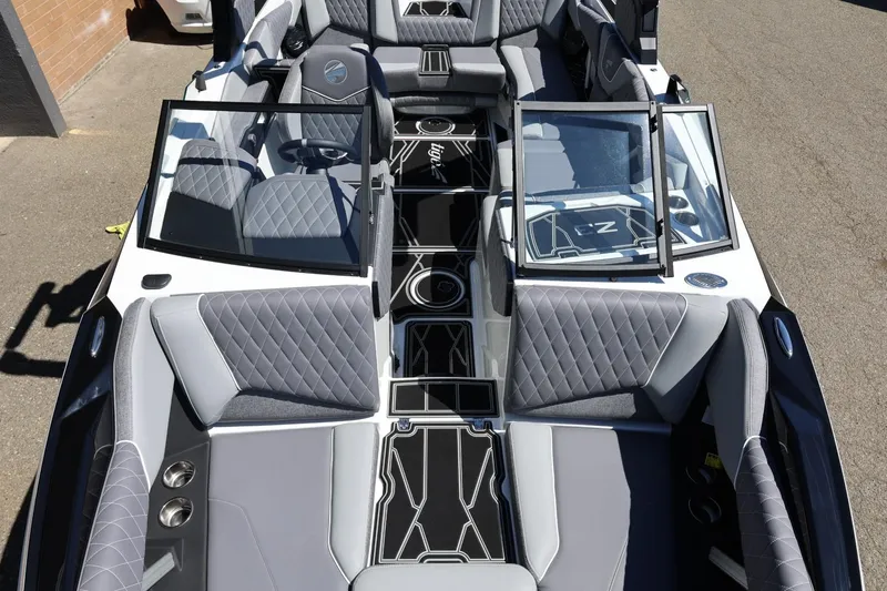 Slide: The Image of 2026 Tigé Z3 boat interior with gray quilted seats and sleek design. - 50