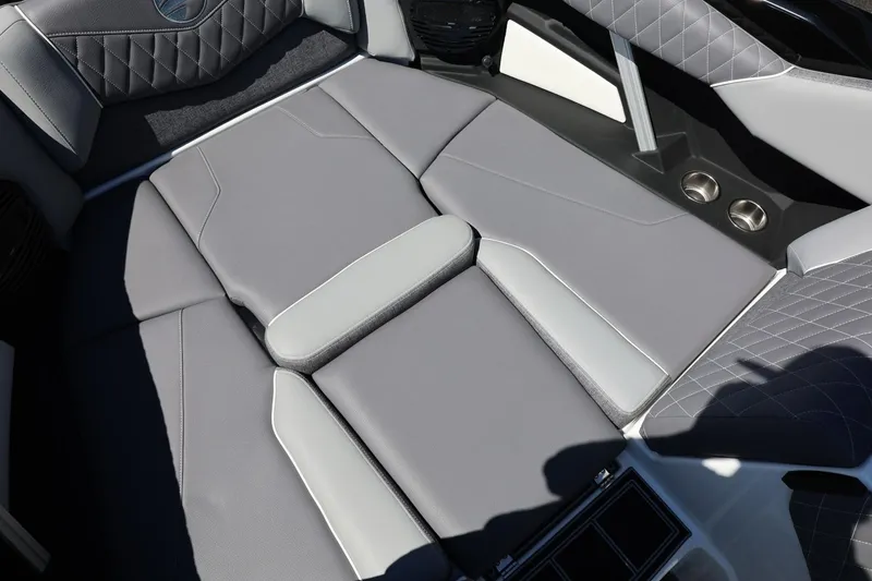 Slide: The Image of 2026 Tigé Z3 boat interior with luxurious gray seating and cup holders. - 56